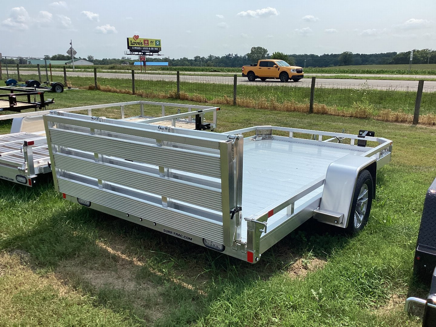 New 2024 SURE-TRAC 7 X 12 Aluminum Low Side Utility 3K Utility Trailer