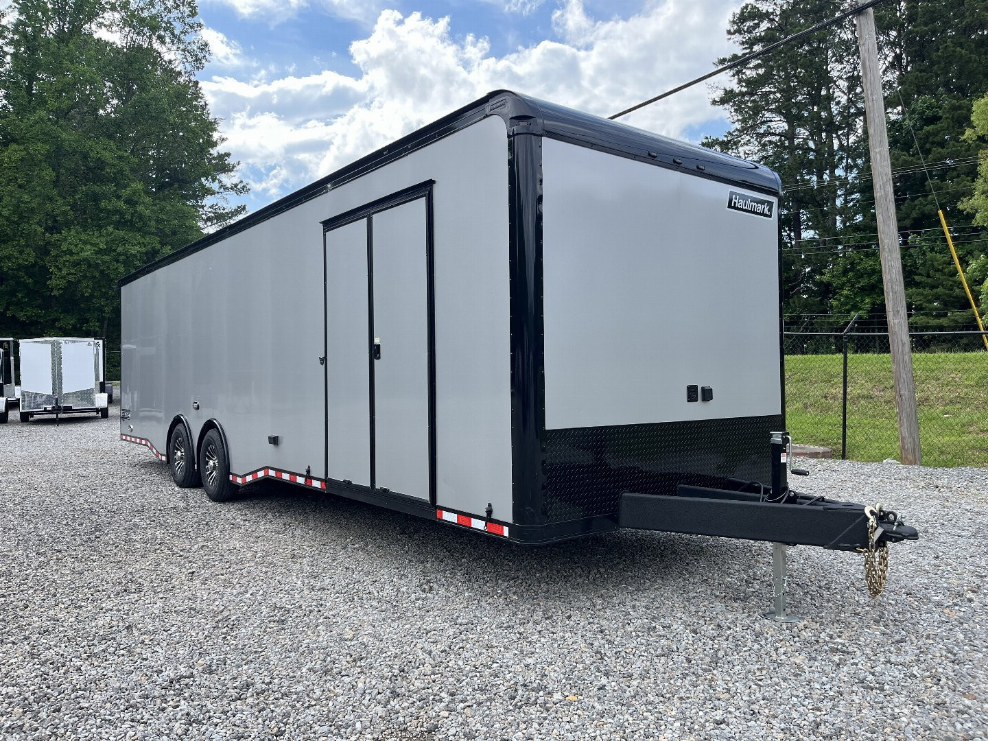 New 2026 HAULMARK 32' EDGE RACE TRAILER, SPORTSMAN PLUS PKG, SILVER POLYCOR WITH BLACK TRIM, 14K GVWR, 96" WIDE REAR DOOR OPENING, 7'4" INTERIOR HEIGHT