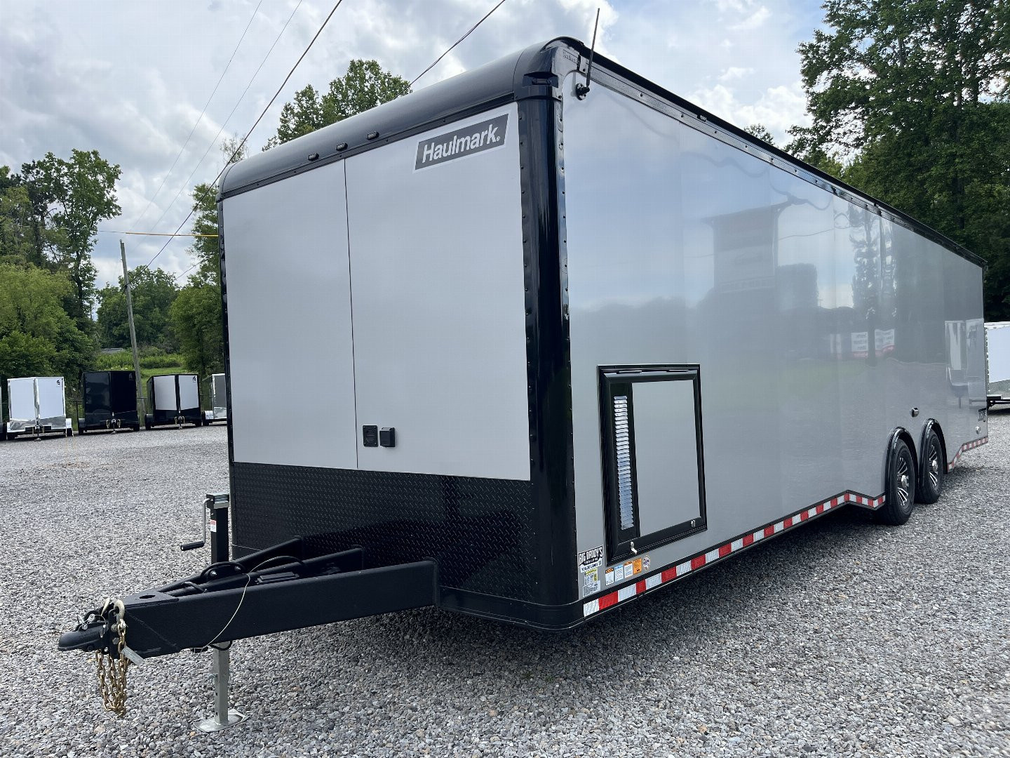 New 2026 HAULMARK 32' EDGE RACE TRAILER, SPORTSMAN PLUS PKG, SILVER POLYCOR WITH BLACK TRIM, 14K GVWR, 96" WIDE REAR DOOR OPENING, 7'4" INTERIOR HEIGHT