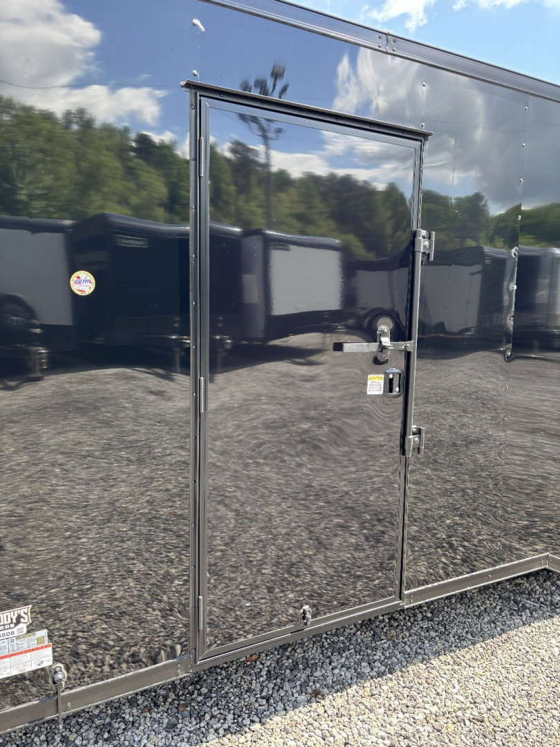 New 2025 Spartan Cargo 8.5x24 Custom Trailer, Black PolyCor With Black Trim, Rubber Coin PKG, 10K Torsion Spread Axles, E-Track, Cabinets