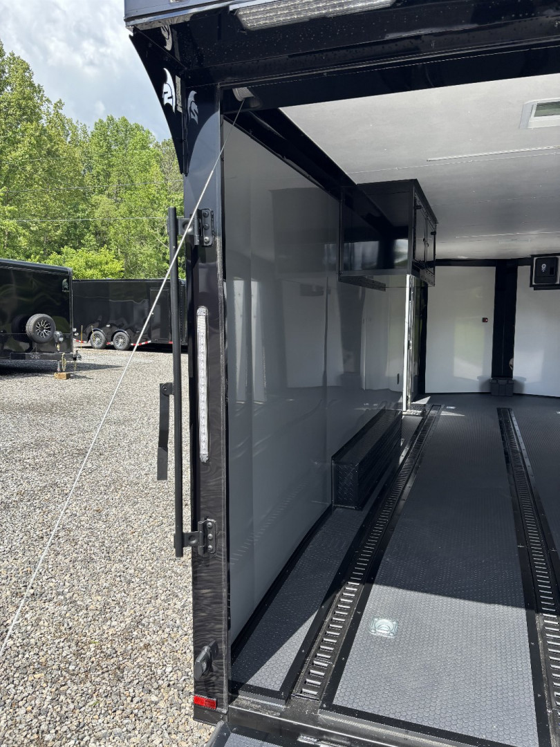 New 2025 Spartan Cargo 8.5x24 Custom Trailer, Black PolyCor With Black Trim, Rubber Coin PKG, 10K Torsion Spread Axles, E-Track, Cabinets