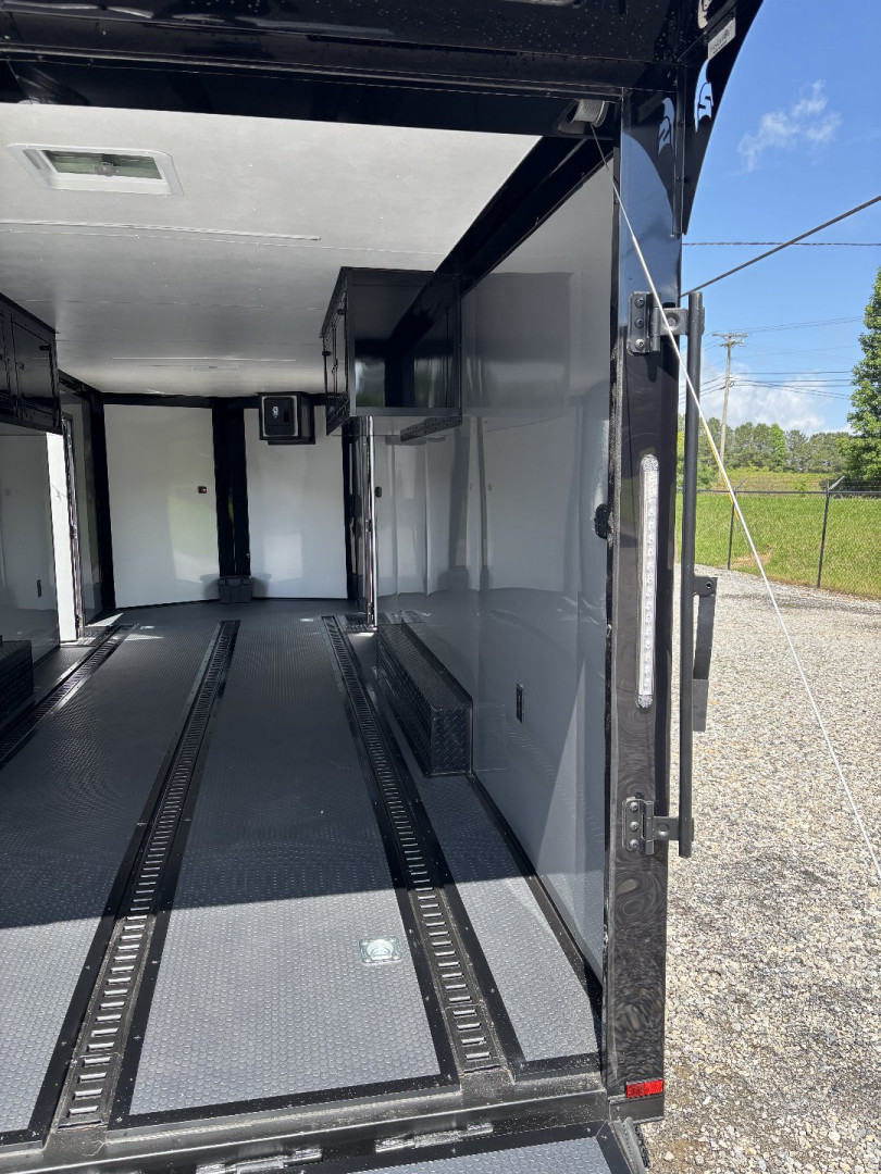 New 2025 Spartan Cargo 8.5x24 Custom Trailer, Black PolyCor With Black Trim, Rubber Coin PKG, 10K Torsion Spread Axles, E-Track, Cabinets