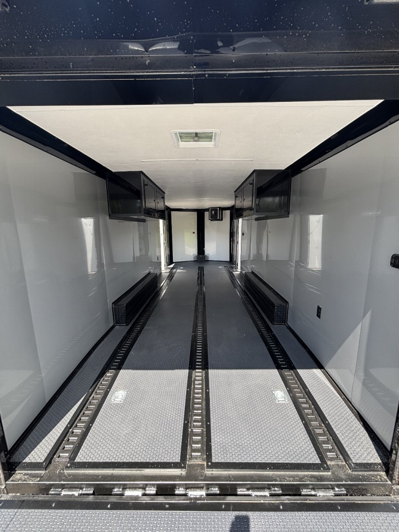 New 2025 Spartan Cargo 8.5x24 Custom Trailer, Black PolyCor With Black Trim, Rubber Coin PKG, 10K Torsion Spread Axles, E-Track, Cabinets