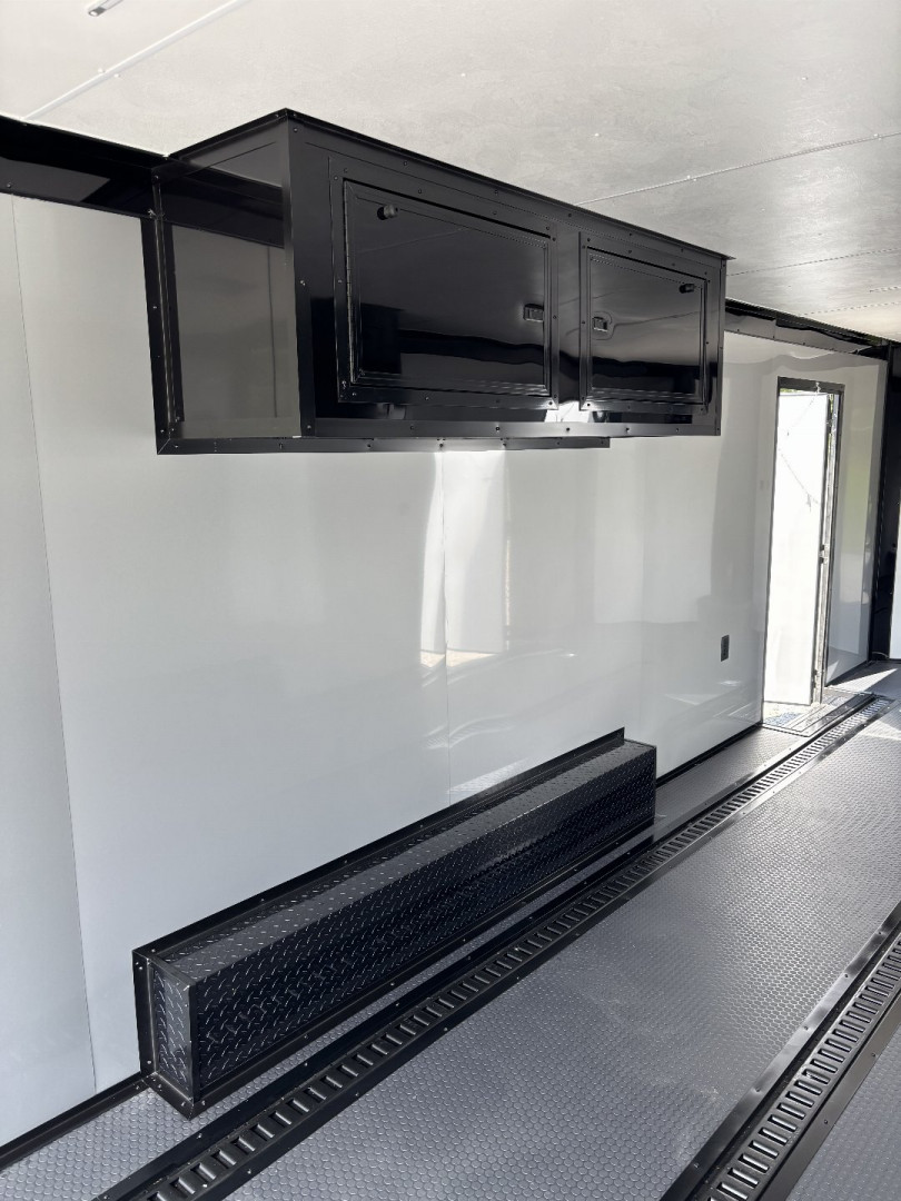 New 2025 Spartan Cargo 8.5x24 Custom Trailer, Black PolyCor With Black Trim, Rubber Coin PKG, 10K Torsion Spread Axles, E-Track, Cabinets