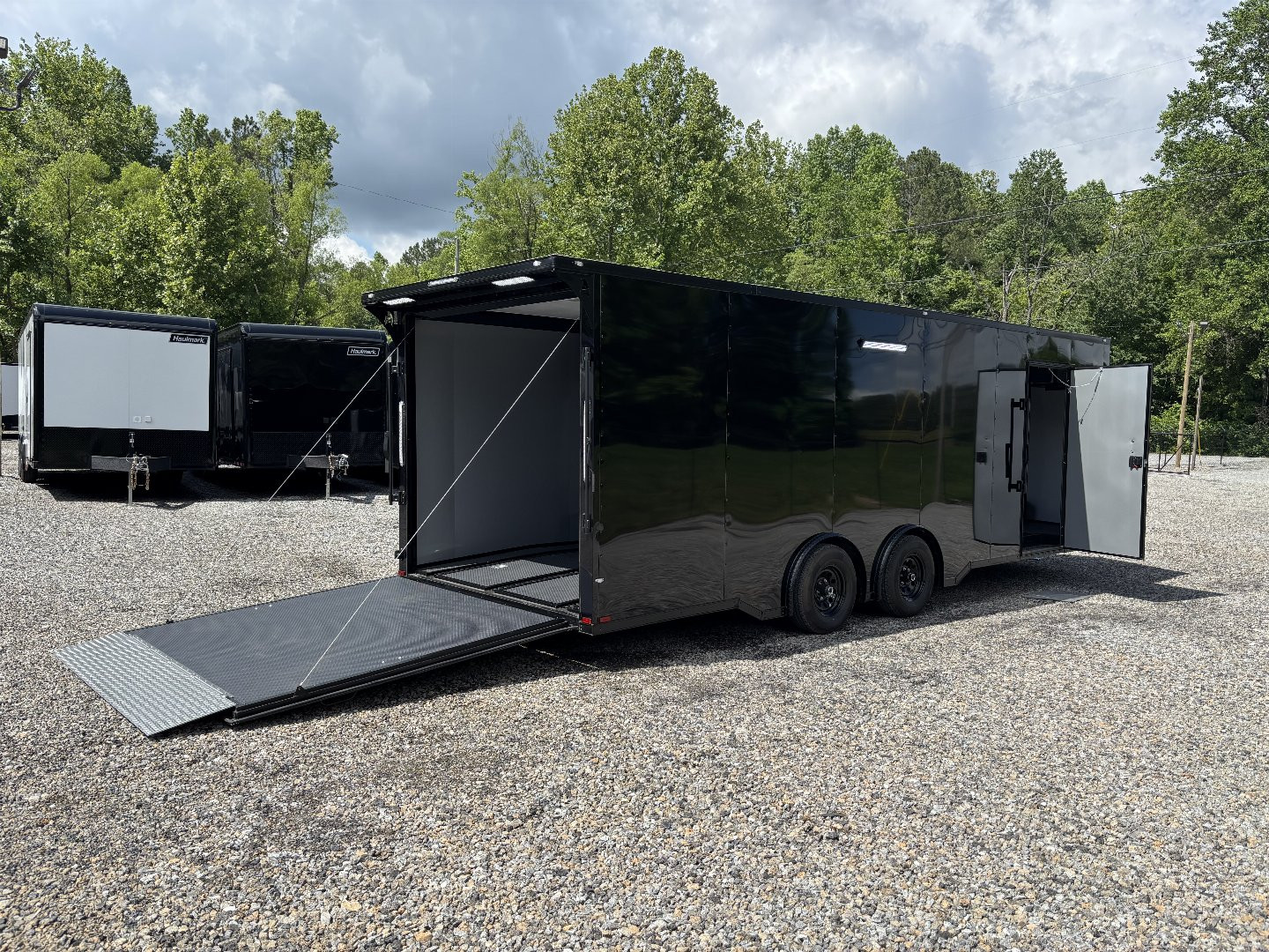 New 2025 Spartan Cargo 8.5x24 Custom Trailer, Black PolyCor With Black Trim, Rubber Coin PKG, 10K Torsion Spread Axles, E-Track, Cabinets
