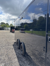 New 2025 Spartan Cargo 8.5x24 Custom Trailer, Black PolyCor With Black Trim, Rubber Coin PKG, 10K Torsion Spread Axles, E-Track, Cabinets