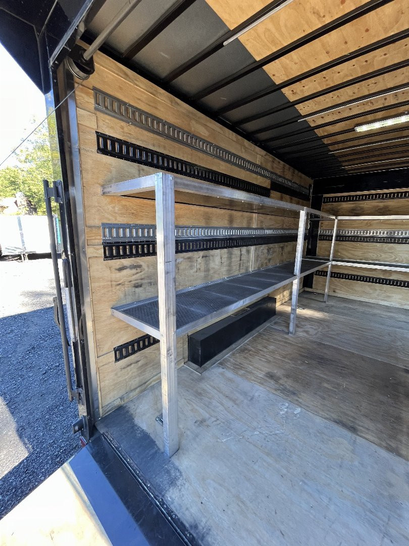 Used 2024 Spartan 8.5x16 Custom Enclosed Trailer, Black PolyCor, 8' Interior, Custom Shelves, E-Track, Flat Front With Cast Upper Corners, 14K GVWR, HD, Awning