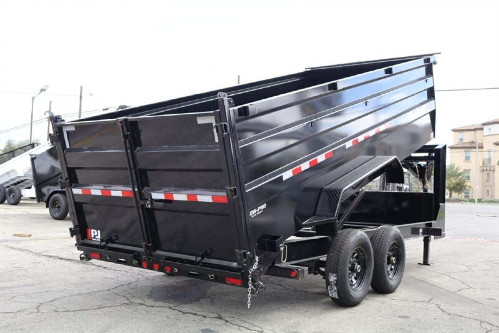 New 2025 PJ Trailers DM162 Dump Trailer