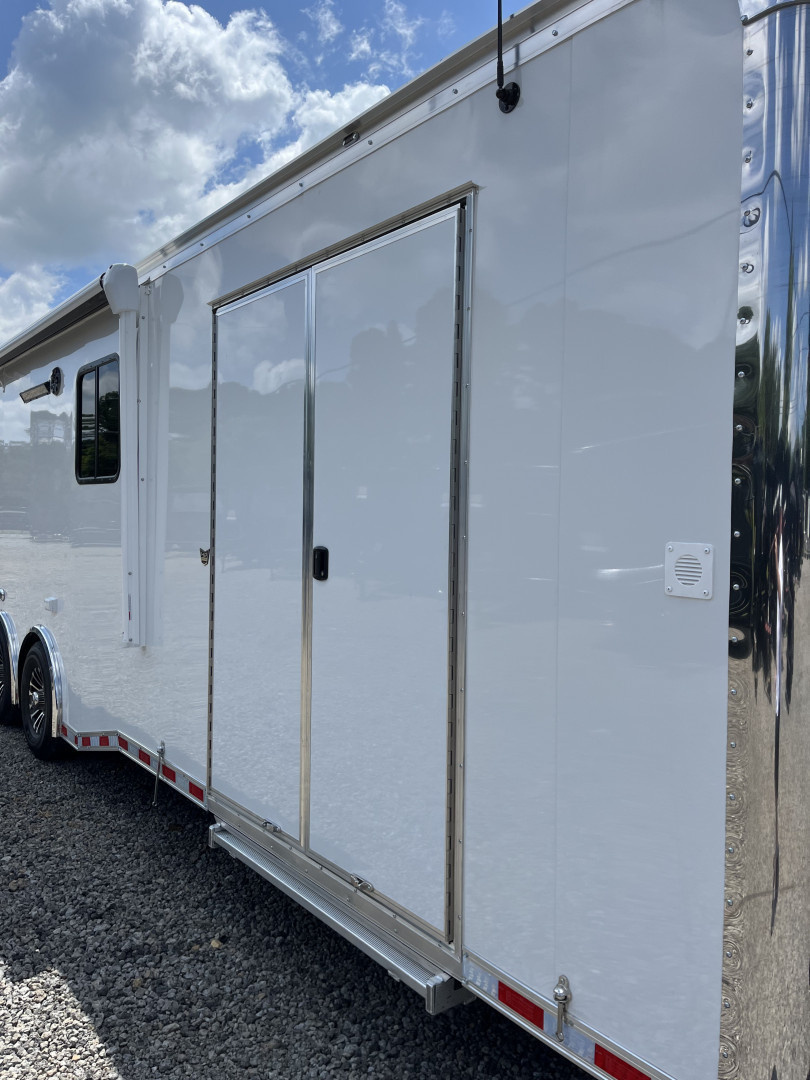 New 2026 Haulmark 34 Bathoom Race Trailer, Air Prep PKG, Awning, Polycor, Insulated, Window, 54" ALX Slide Out Step, A/C + Heat