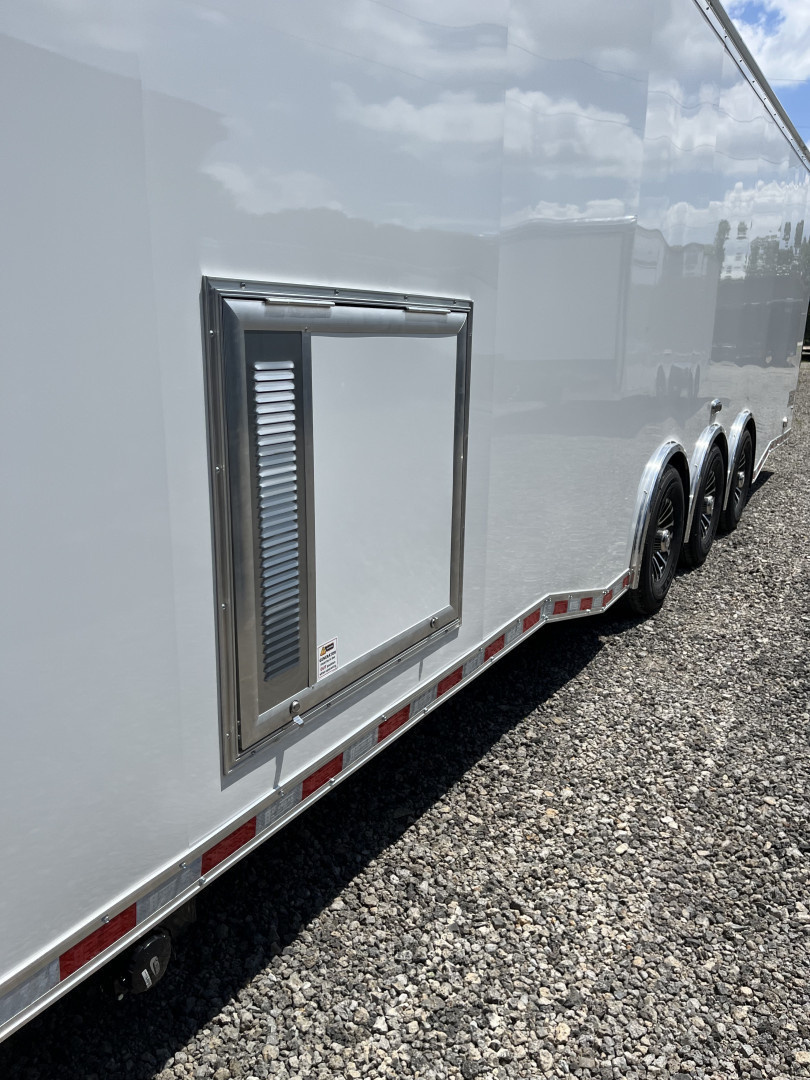 New 2026 Haulmark 34 Bathoom Race Trailer, Air Prep PKG, Awning, Polycor, Insulated, Window, 54" ALX Slide Out Step, A/C + Heat