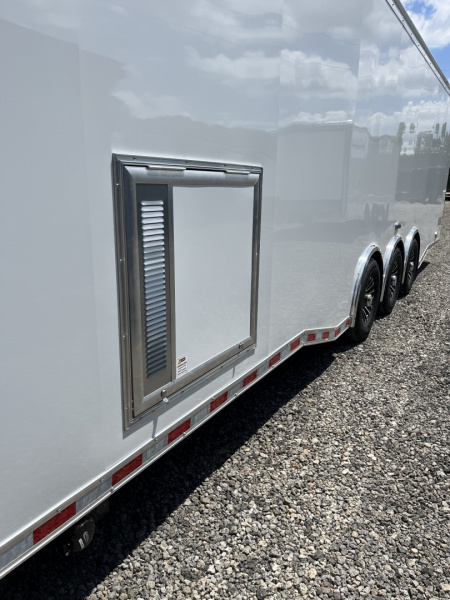 New 2026 Haulmark 34 Bathoom Race Trailer, Air Prep PKG, Awning, Polycor, Insulated, Window, 54" ALX Slide Out Step, A/C + Heat