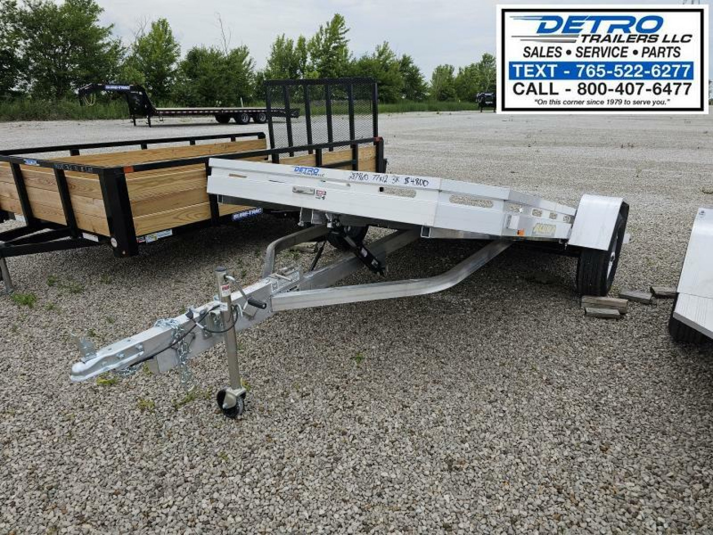 New 2025 Aluma 7712H-TILT-S 3K Torsion Tilt Utility Trailer