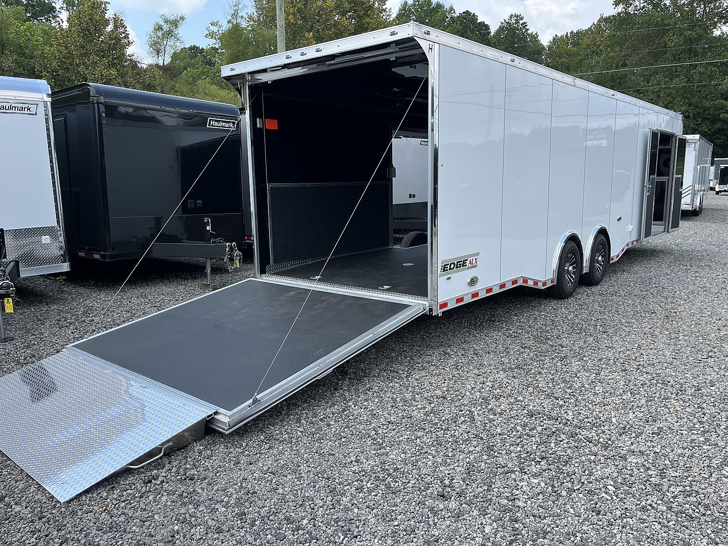 New 2025 Haulmark 32 EDGE ALUMINUM Race Trailer, Sportsman Plus PKG, Premium Escape Door, White PolyCor, 14K GVWR