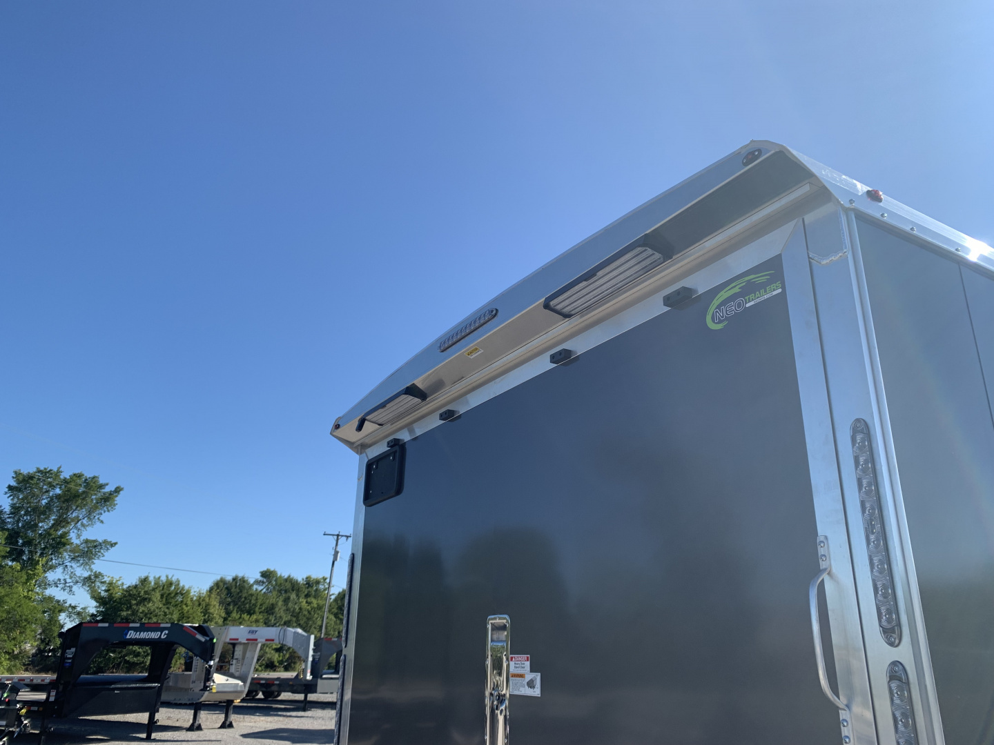 New 2026 NEO Trailers NAX2485R6 (8.5' X 24') 9.9K V-Nose Snowmobile Trailer