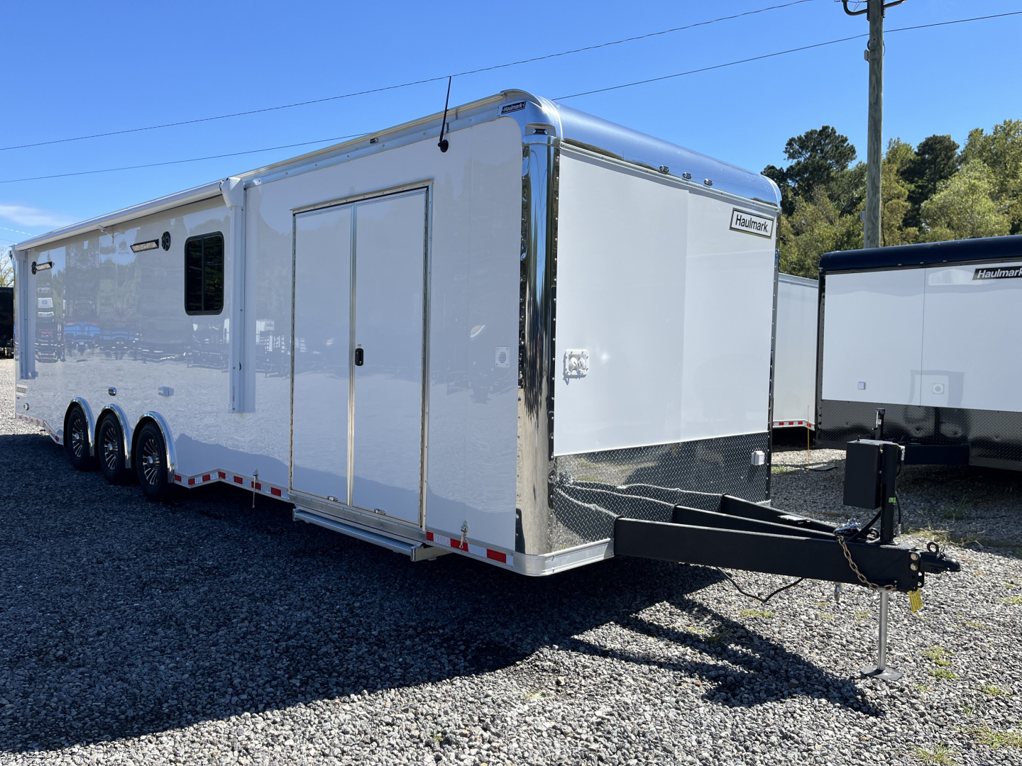 New 2026 Haulmark 34 Bathoom Race Trailer, Air Prep PKG, Awning, Polycor, Insulated, Window, 54" ALX Slide Out Step, A/C + Heat