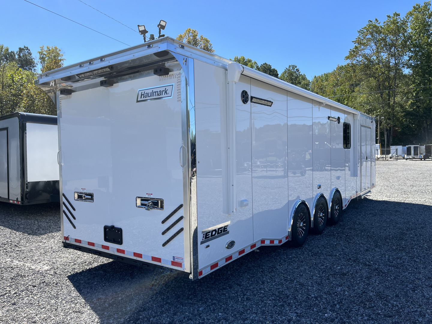 New 2026 Haulmark 34 Bathoom Race Trailer, Air Prep PKG, Awning, Polycor, Insulated, Window, 54" ALX Slide Out Step, A/C + Heat
