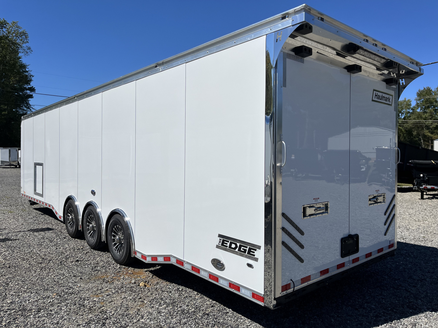 New 2026 Haulmark 34 Bathoom Race Trailer, Air Prep PKG, Awning, Polycor, Insulated, Window, 54" ALX Slide Out Step, A/C + Heat