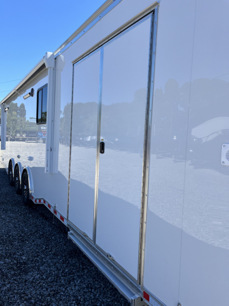 New 2026 Haulmark 34 Bathoom Race Trailer, Air Prep PKG, Awning, Polycor, Insulated, Window, 54" ALX Slide Out Step, A/C + Heat