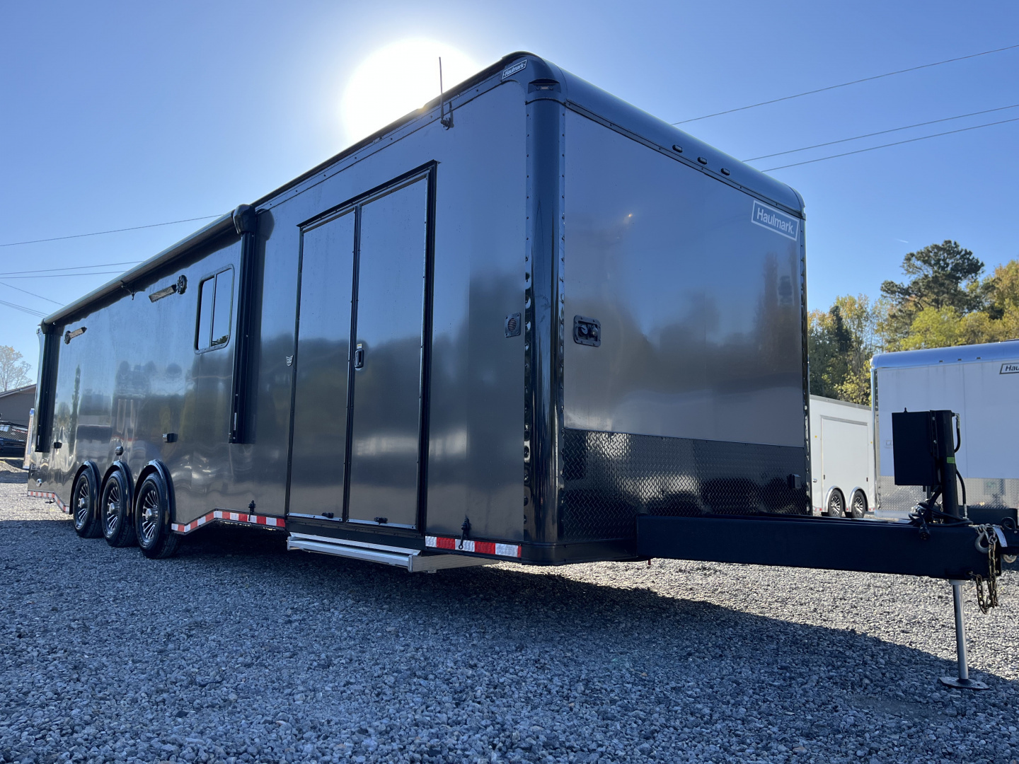New 2026 Haulmark 34 Bathoom Race Trailer, Air Prep PKG, Awning, Polycor, Insulated, Window, 54" ALX Slide Out Step, A/C + Heat