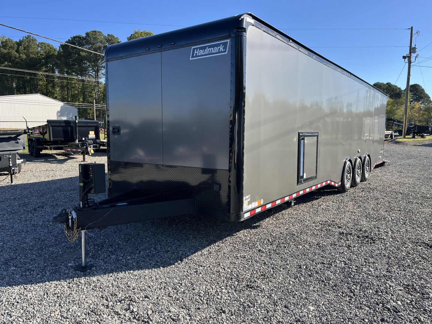 New 2026 Haulmark 34 Bathoom Race Trailer, Air Prep PKG, Awning, Polycor, Insulated, Window, 54" ALX Slide Out Step, A/C + Heat