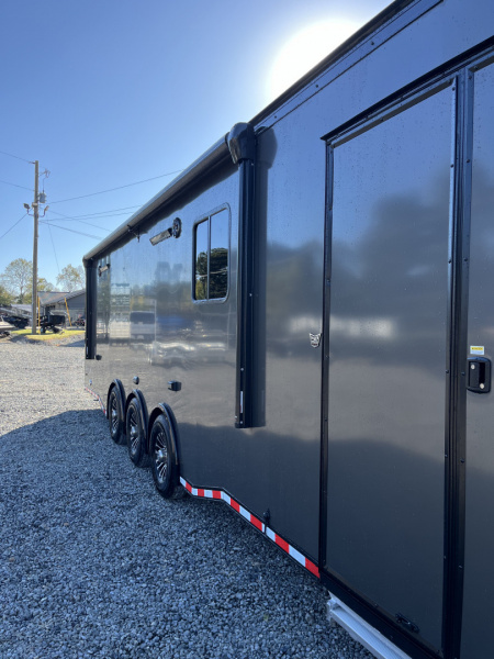 New 2026 Haulmark 34 Bathoom Race Trailer, Air Prep PKG, Awning, Polycor, Insulated, Window, 54" ALX Slide Out Step, A/C + Heat