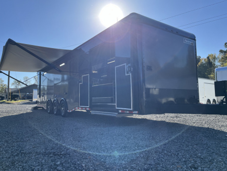 New 2026 Haulmark 34 Bathoom Race Trailer, Air Prep PKG, Awning, Polycor, Insulated, Window, 54" ALX Slide Out Step, A/C + Heat