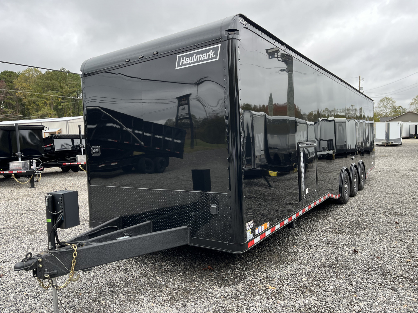 New 2026 Haulmark 34 Bathoom Race Trailer, Air Prep PKG, Awning, Polycor, Insulated, Window, 54" ALX Slide Out Step, A/C + Heat