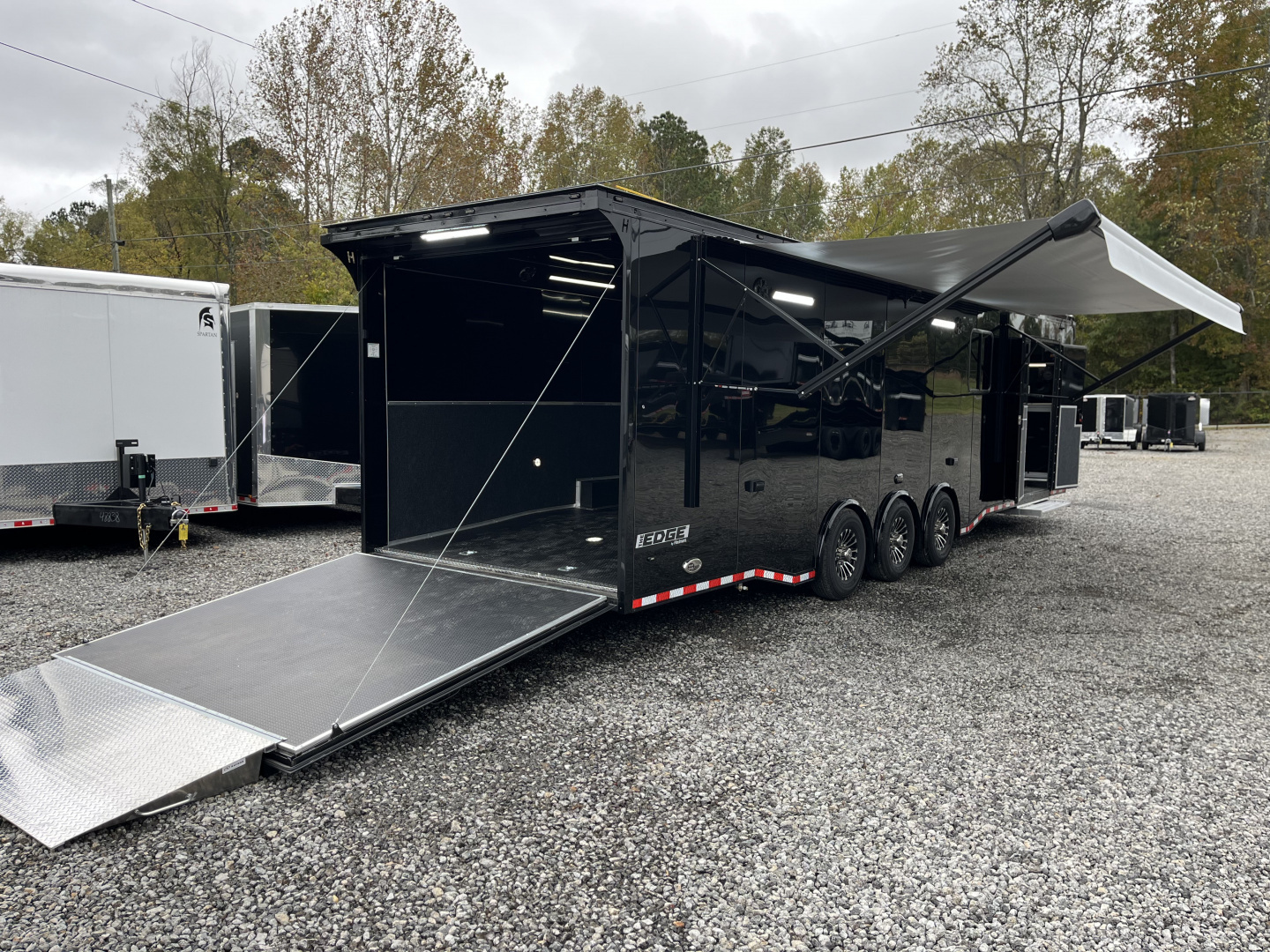 New 2026 Haulmark 34 Bathoom Race Trailer, Air Prep PKG, Awning, Polycor, Insulated, Window, 54" ALX Slide Out Step, A/C + Heat