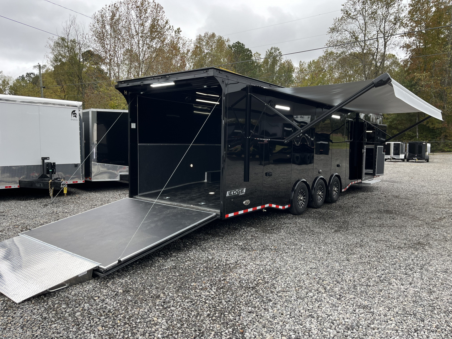 New 2026 Haulmark 34 Bathoom Race Trailer, Air Prep PKG, Awning, Polycor, Insulated, Window, 54" ALX Slide Out Step, A/C + Heat