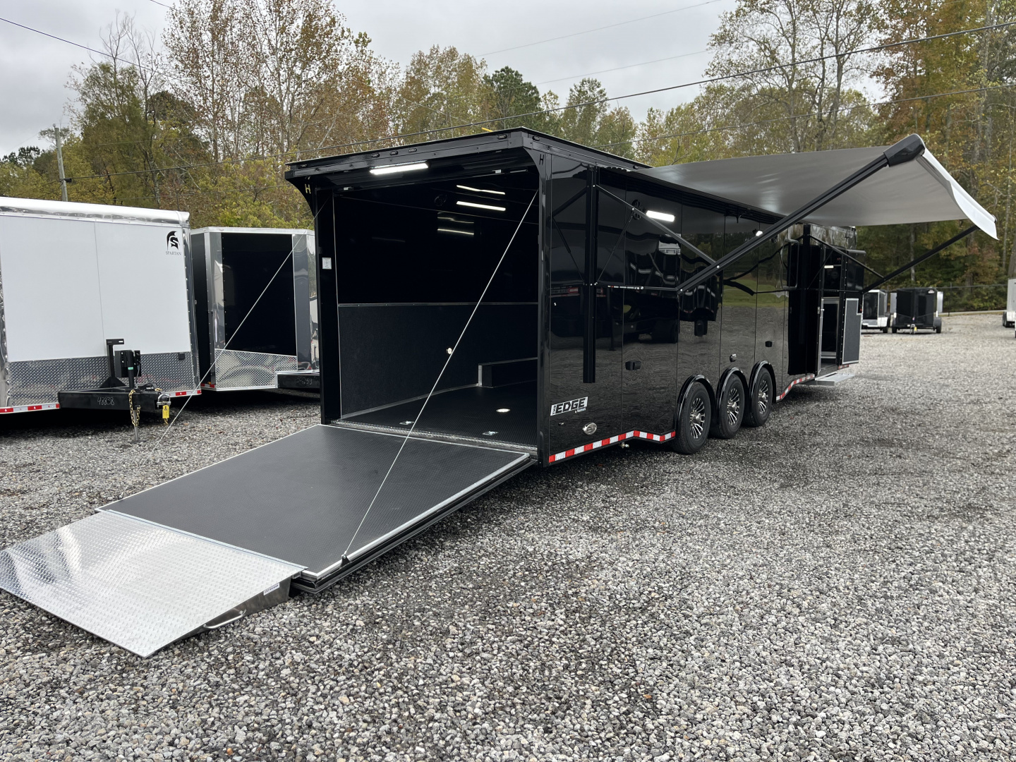 New 2026 Haulmark 34 Bathoom Race Trailer, Air Prep PKG, Awning, Polycor, Insulated, Window, 54" ALX Slide Out Step, A/C + Heat