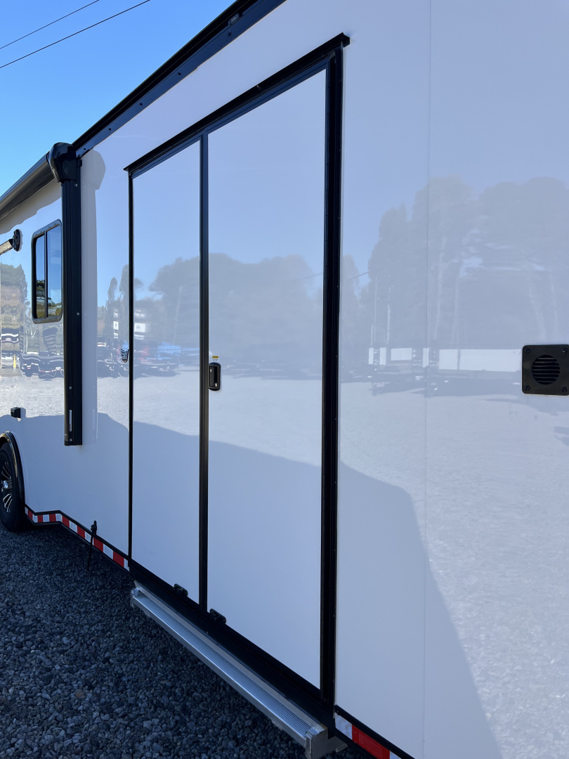 New 2026 Haulmark 34 Bathoom Race Trailer, Air Prep PKG, Awning, Polycor, Insulated, Window, 54" ALX Slide Out Step, A/C + Heat