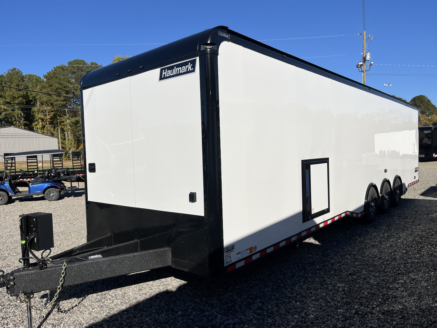 New 2026 Haulmark 34 Bathoom Race Trailer, Air Prep PKG, Awning, Polycor, Insulated, Window, 54" ALX Slide Out Step, A/C + Heat