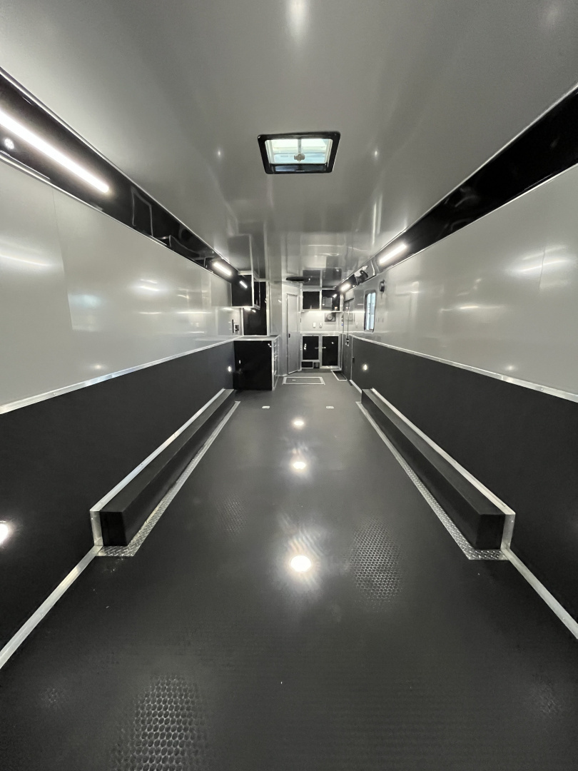 New 2026 Haulmark 34 Bathoom Race Trailer, Air Prep PKG, Awning, Polycor, Insulated, Window, 54" ALX Slide Out Step, A/C + Heat