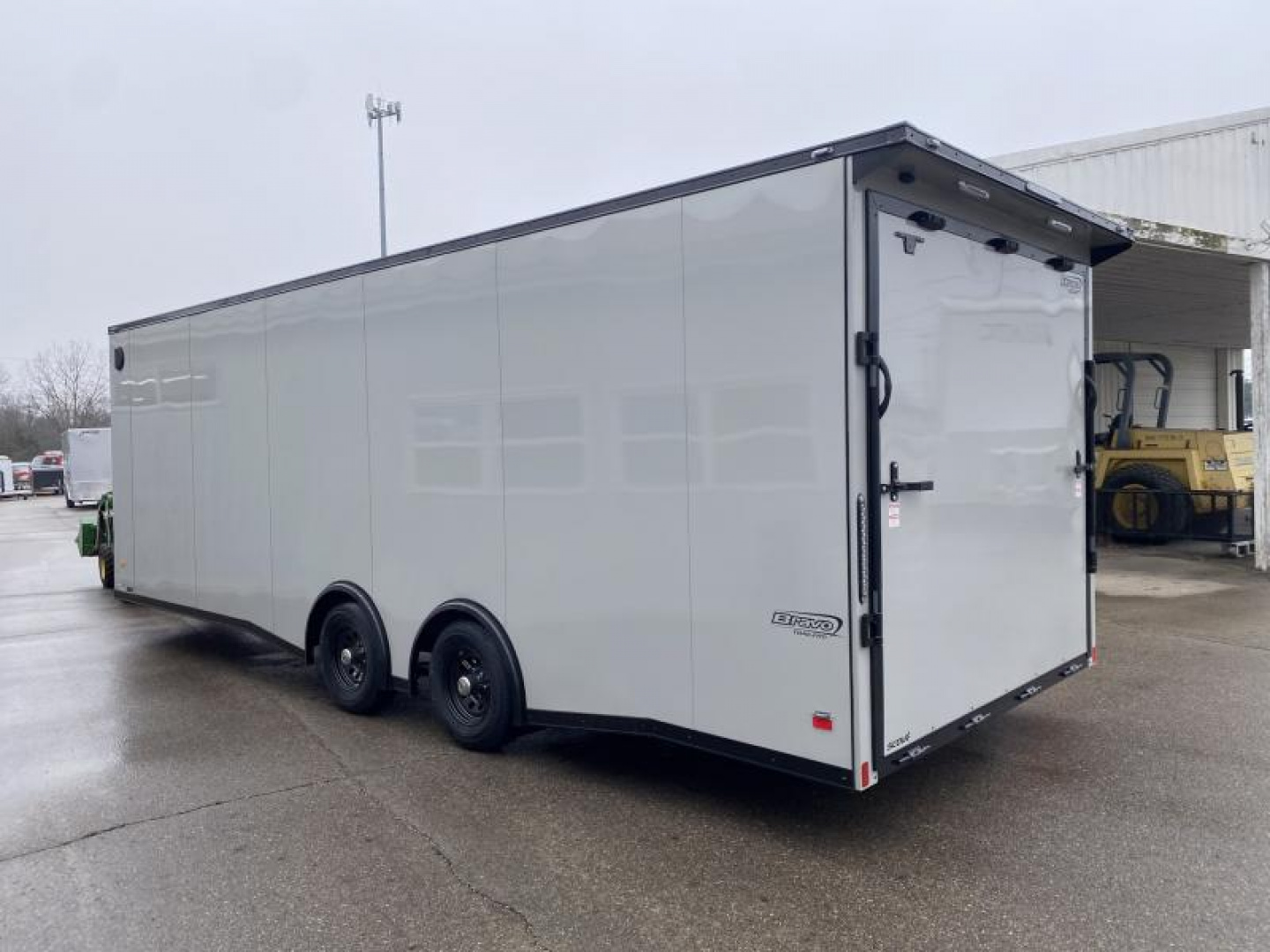 New 2025 Bravo Trailers SCOUT 24 FT ENCLOSED CAR HAULER 7 FT INT BLACK OUT TRIM 10K GVWR *FACTORY CLOSE OUT*