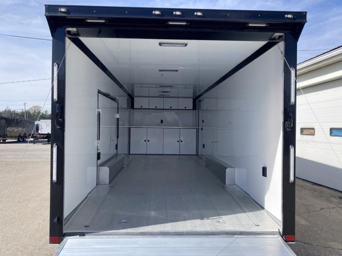 New 2023 ATC 24 FT ROM 500 ALUMINUM ENCLOSED RACE CAR HAULER WITH ESCAPE DOOR AND ALUMINUM FLOOR