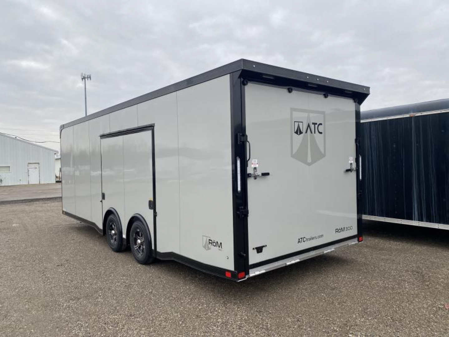 New 2023 ATC 24 FT ENCLOSED CAR HAULER 7 FT INT HEIGHT WITH ESCAPE DOOR AND BLACK OUT TRIM ROM 300