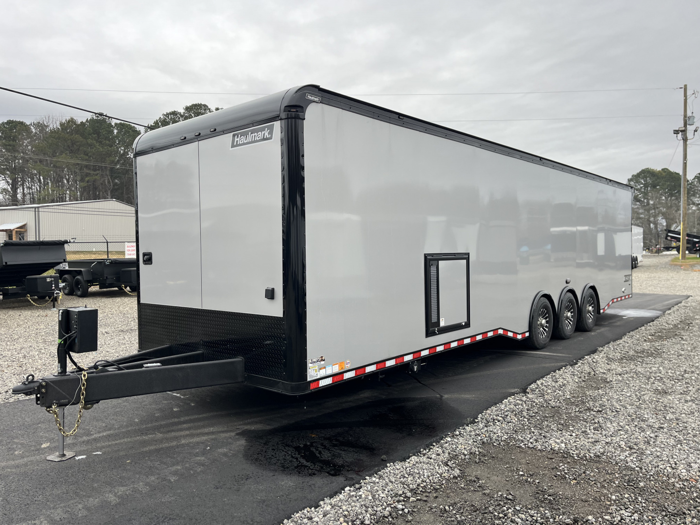 New 2026 Haulmark 34 Bathoom Race Trailer, Air Prep PKG, Awning, Polycor, Insulated, Window, 54" ALX Slide Out Step, A/C + Heat