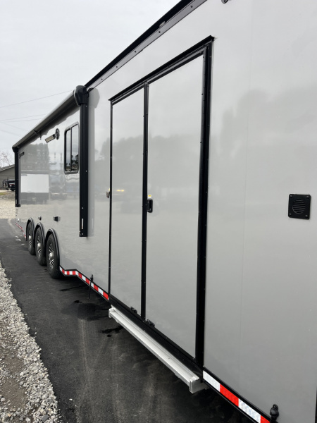 New 2026 Haulmark 34 Bathoom Race Trailer, Air Prep PKG, Awning, Polycor, Insulated, Window, 54" ALX Slide Out Step, A/C + Heat