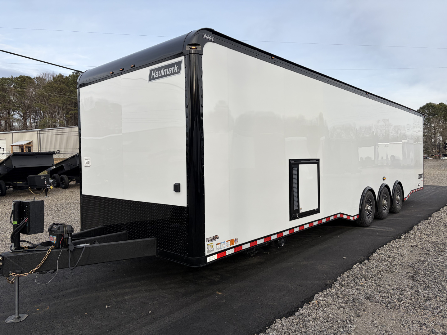 New 2026 Haulmark 34 Bathroom Race Trailer, Air Prep PKG, Awning, Polycor, Insulated, Window, 54" ALX Slide Out Step, A/C + Heat