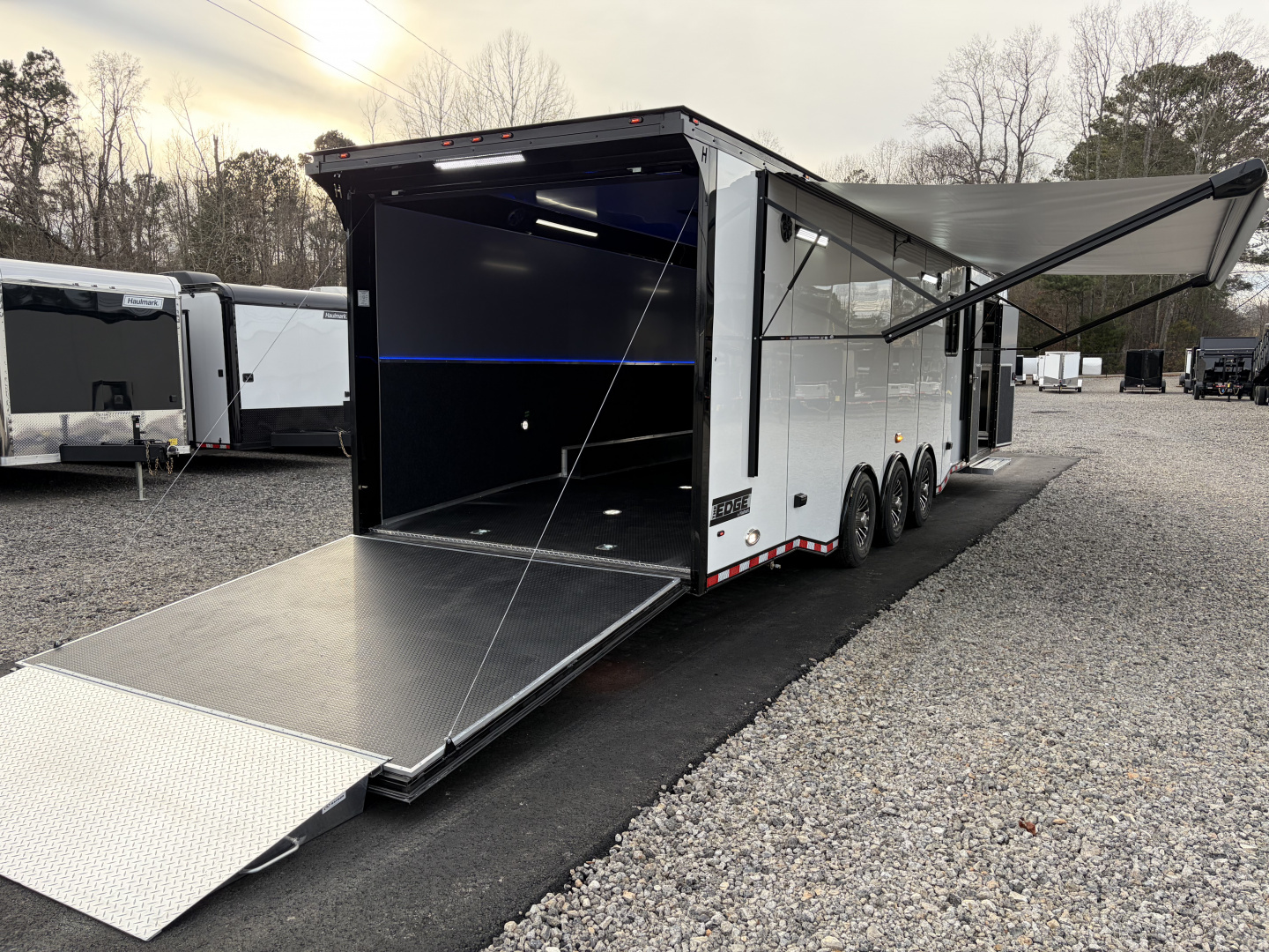 New 2026 Haulmark 34 Bathroom Race Trailer, Air Prep PKG, Awning, Polycor, Insulated, Window, 54" ALX Slide Out Step, A/C + Heat