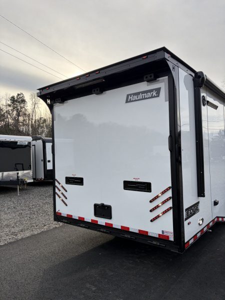 New 2026 Haulmark 34 Bathroom Race Trailer, Air Prep PKG, Awning, Polycor, Insulated, Window, 54" ALX Slide Out Step, A/C + Heat