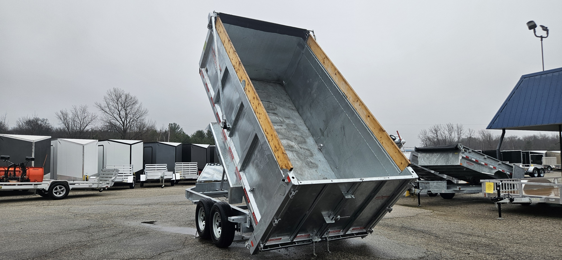 New 82" X 14' GALVANIZED DUMP 7 K AXLES 58" SIDES W/ WOOD RAMP & TARP INCLUDED 2026 TRIUMPH