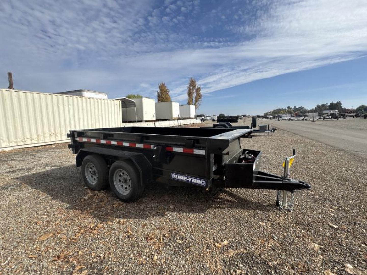 New 2024 Sure-Trac 5 x 10 Low Profile Homeowner Dump Trailer  7K TA Single Ram