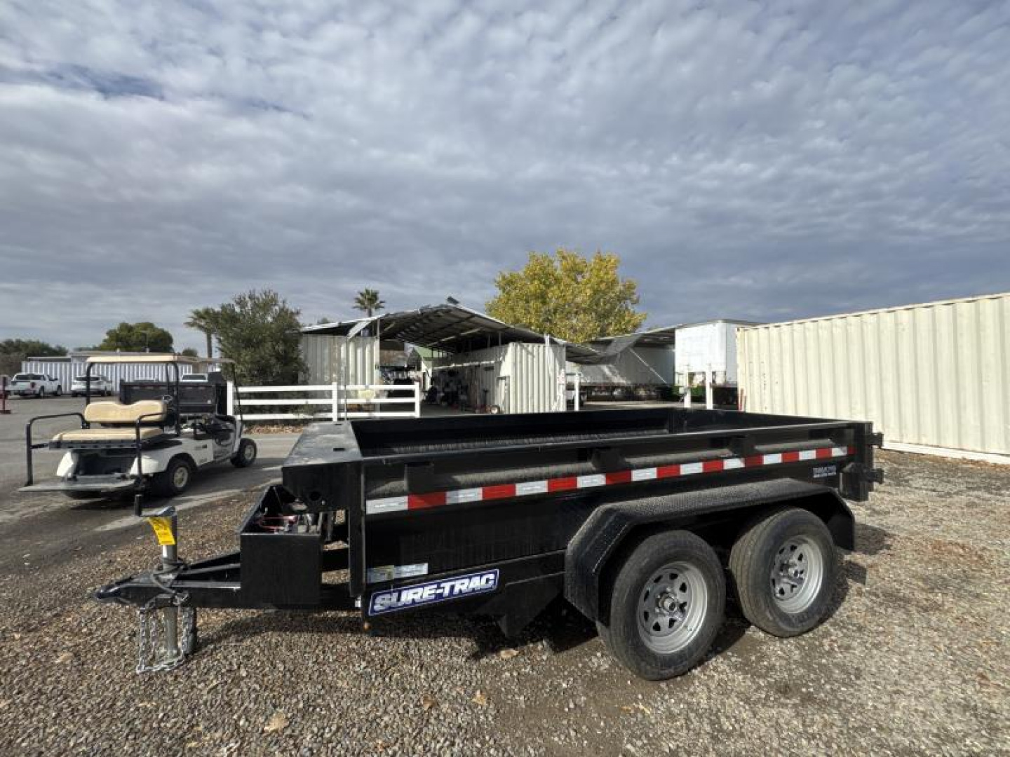 New 2024 Sure-Trac 5 x 10 Low Profile Homeowner Dump Trailer  7K TA Single Ram