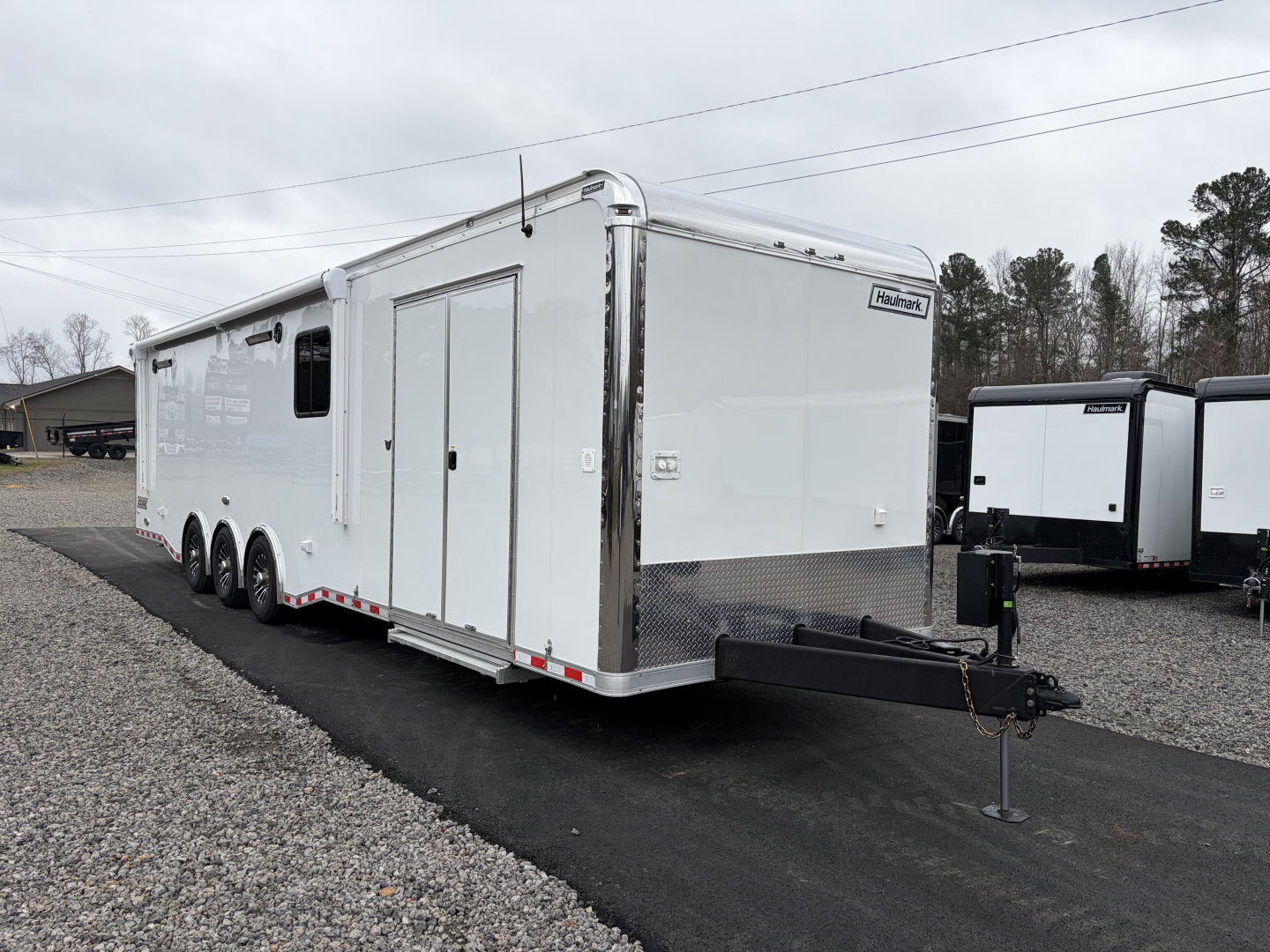 New 2026 Haulmark 34 Bathoom Race Trailer, Air Prep PKG, Awning, Polycor, Insulated, Window, 54" ALX Slide Out Step, A/C + Heat