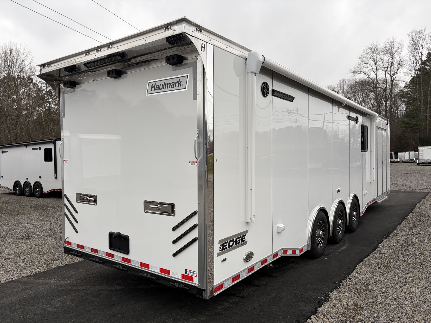 New 2026 Haulmark 34 Bathoom Race Trailer, Air Prep PKG, Awning, Polycor, Insulated, Window, 54" ALX Slide Out Step, A/C + Heat