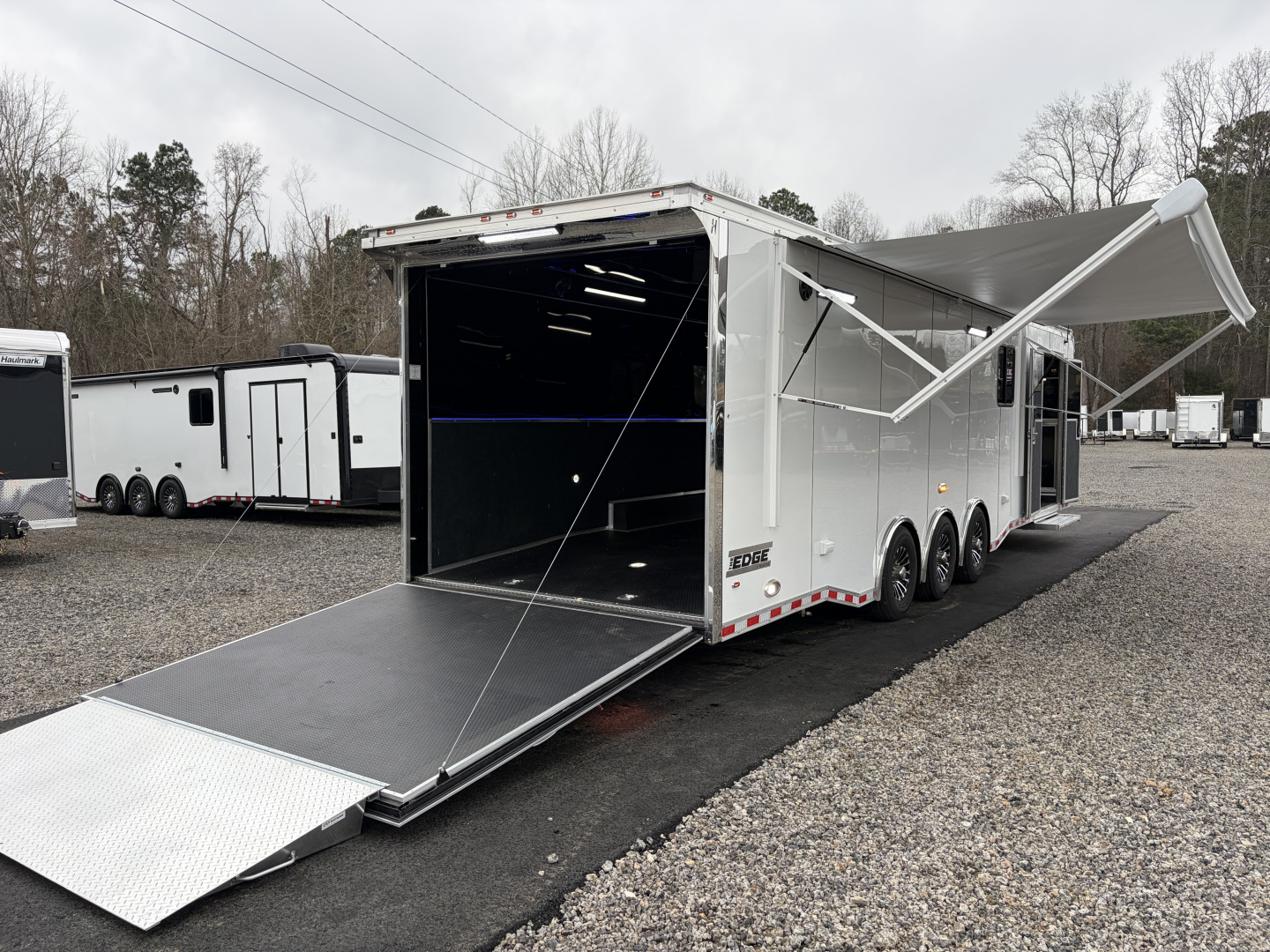 New 2026 Haulmark 34 Bathoom Race Trailer, Air Prep PKG, Awning, Polycor, Insulated, Window, 54" ALX Slide Out Step, A/C + Heat