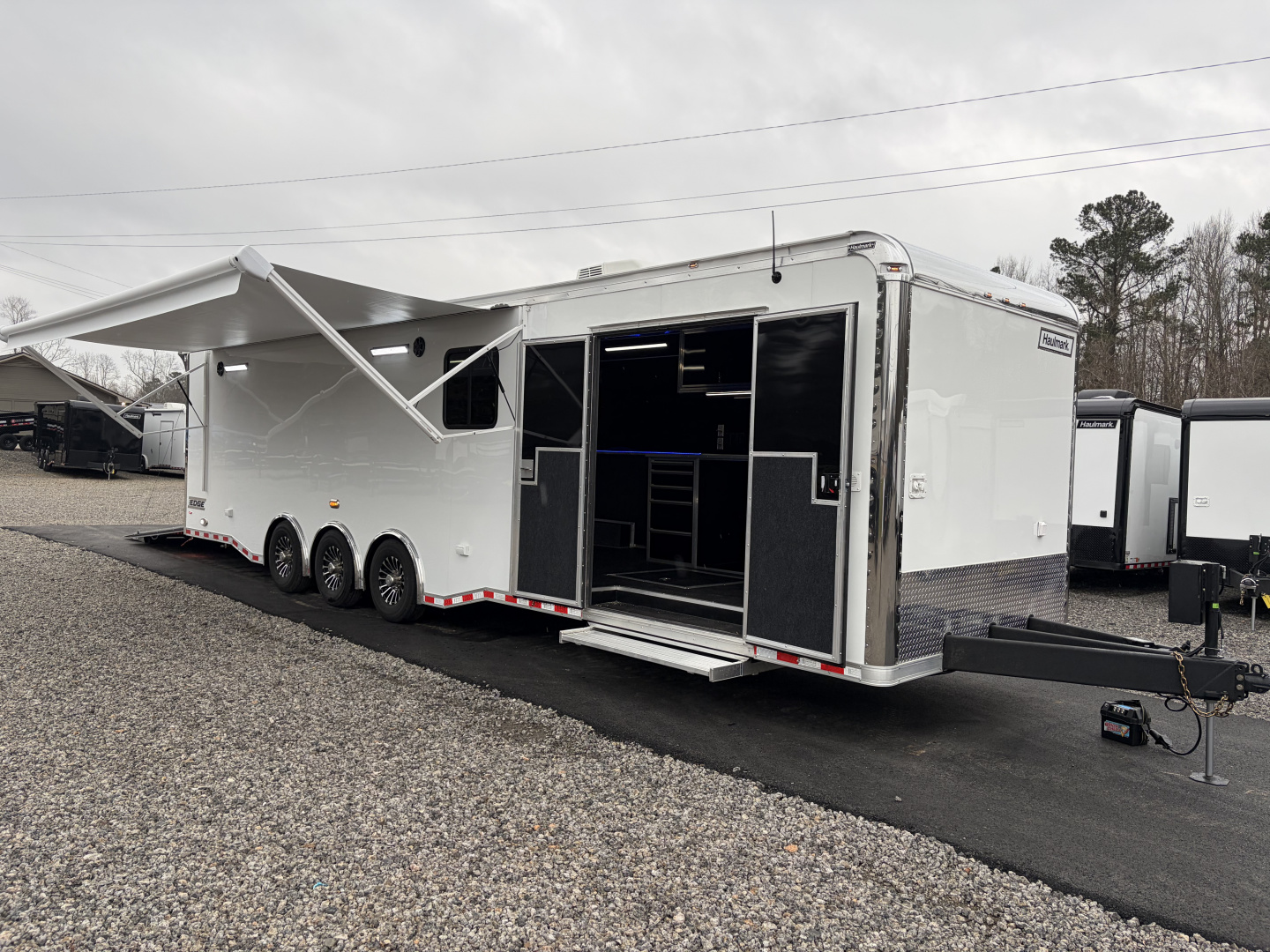 New 2026 Haulmark 34 Bathoom Race Trailer, Air Prep PKG, Awning, Polycor, Insulated, Window, 54" ALX Slide Out Step, A/C + Heat