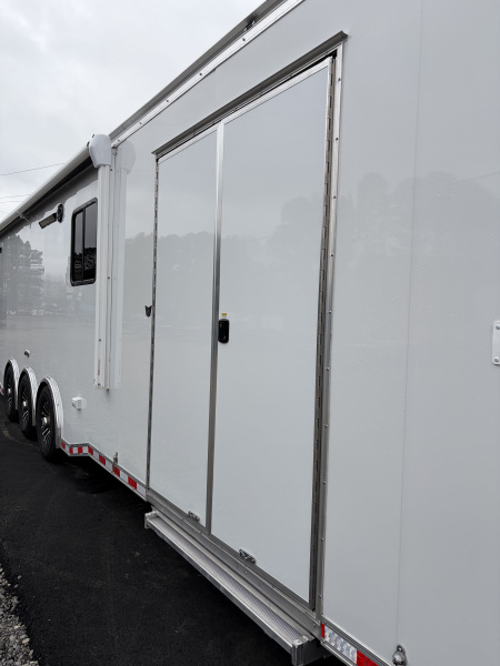 New 2026 Haulmark 34 Bathoom Race Trailer, Air Prep PKG, Awning, Polycor, Insulated, Window, 54" ALX Slide Out Step, A/C + Heat